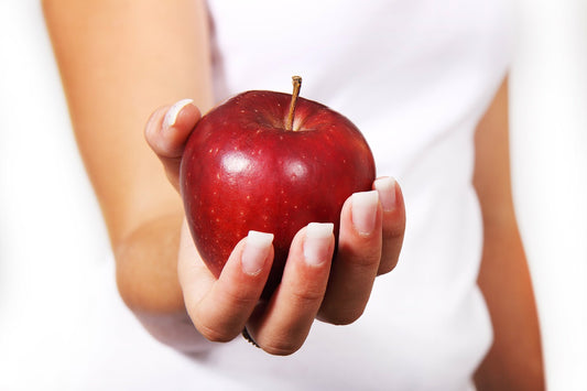 An apple in a hand