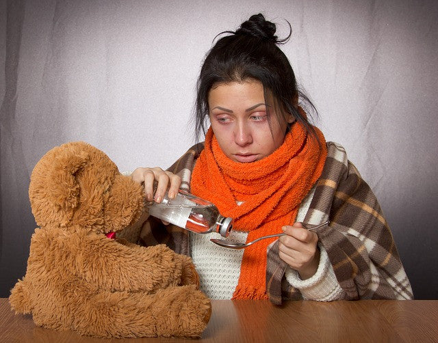 Sick girl and a teddy bear