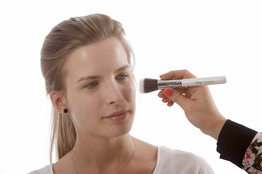 A girl and a makeup brush