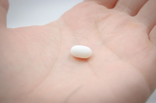 A pill on a hand