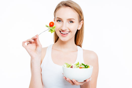 Woman eating salad